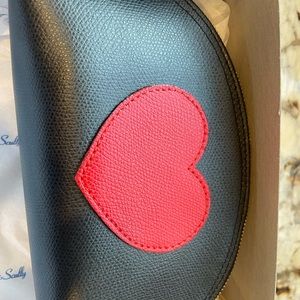 Beautiful leather zipper pouch perfect for travel! Black with a red heart
